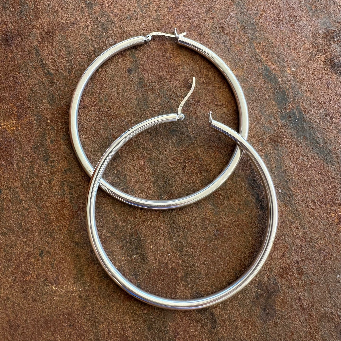 Extra large sterling silver hoop earrings showing click back fastening, Primitive Earth