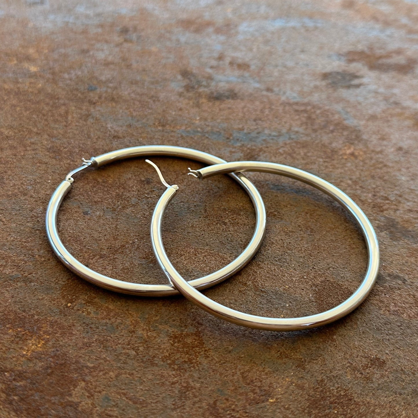 Extra large sterling silver hoop earrings angled view, Primitive Earth Australian jewellery