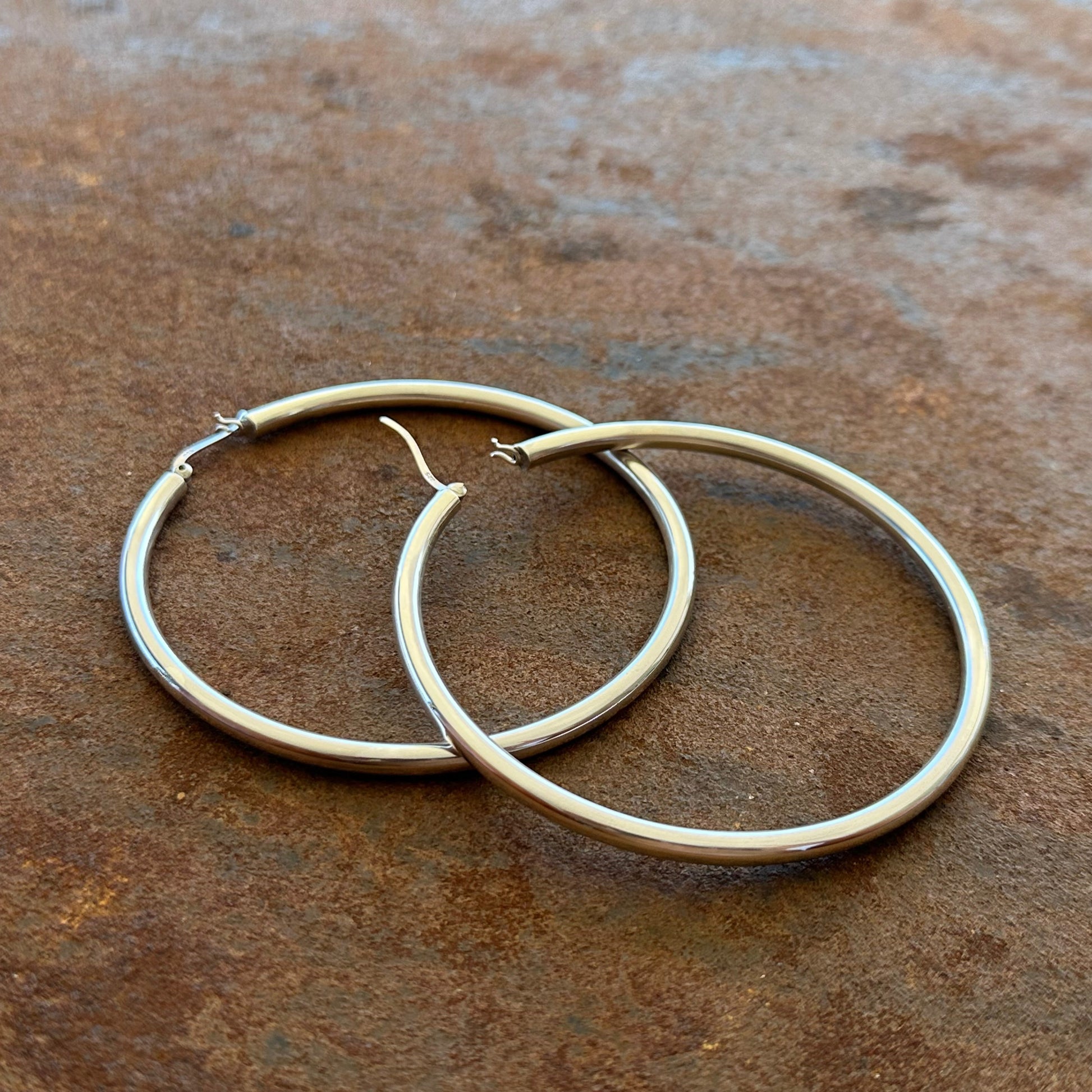 Extra large sterling silver hoop earrings angled view, Primitive Earth Australian jewellery