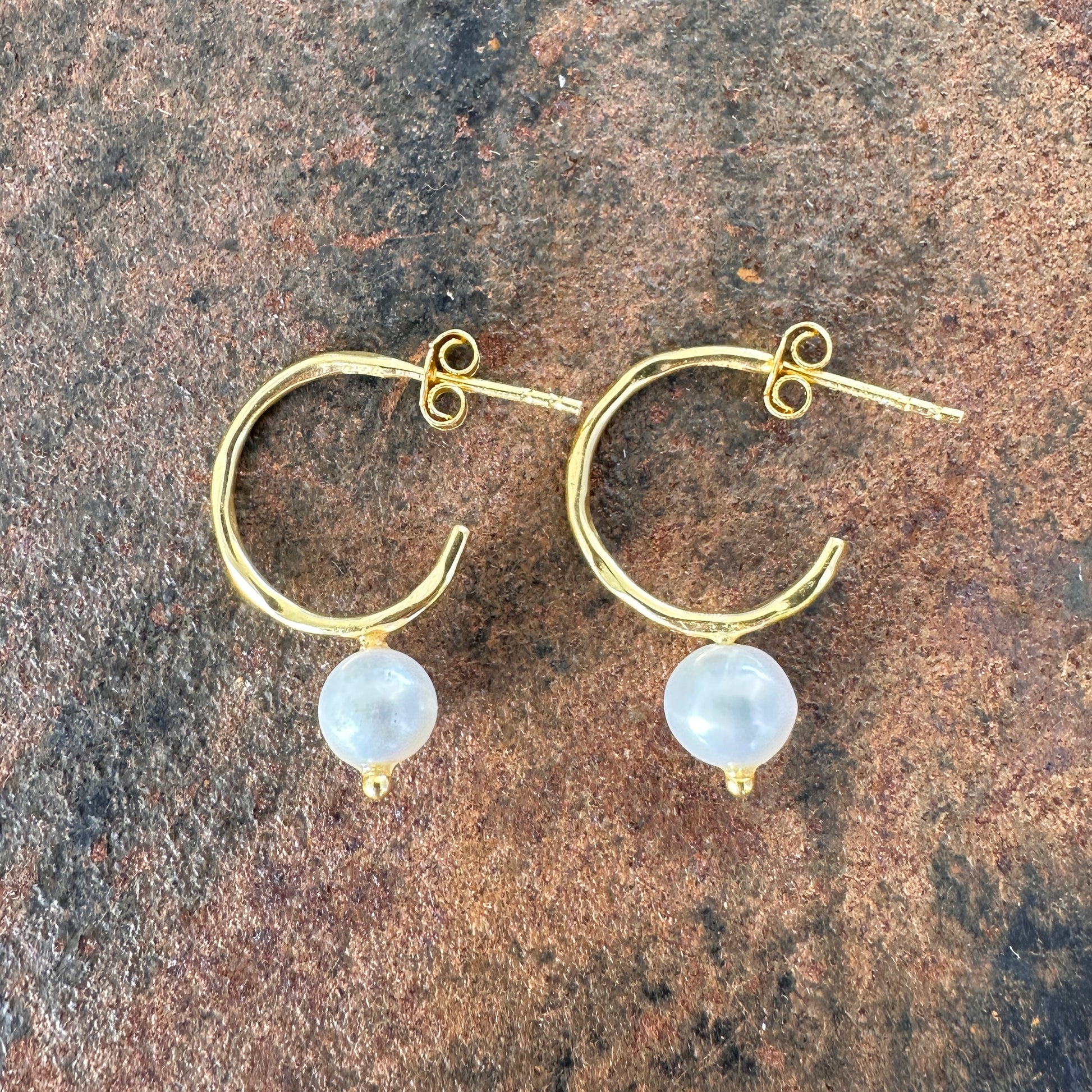 Single pearl on hammered gold hoop earrings. Part of the Primitive Earth Silk Road Collection. Sunshine Coast, Queensland.